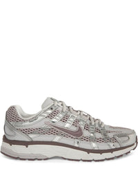 Nike P-6000 sneakers in a silver and purple colorway, featuring a breathable mesh upper with contrasting paneling.