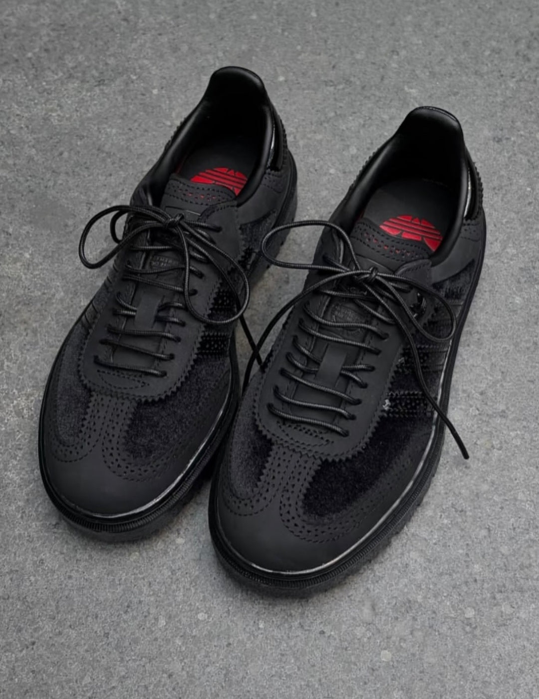 Adidas Samba WTR sneakers in black, featuring a textured lug sole and premium paneled design.