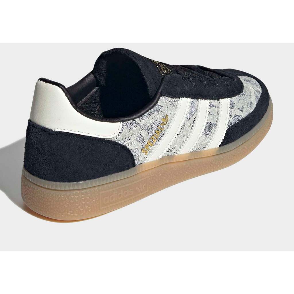 Adidas Handball Spezial sneakers in black with a white lace overlay.