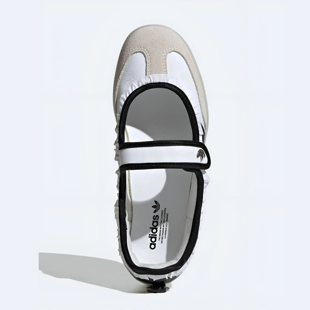 Adidas Samba Jane shoes in a white and black colorway, featuring a unique ruffle trim detail.
