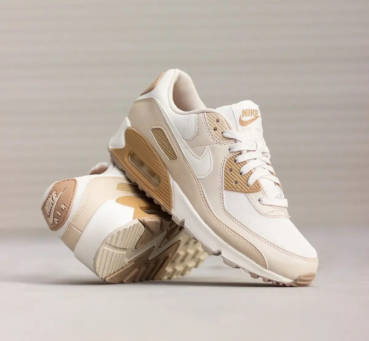 Nike Air Max 90 sneakers in a neutral beige and "Coconut Milk" colorway.