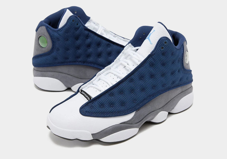 Nike Air Jordan 13 Retro "Flint" sneakers, featuring a prominent French Blue mesh overlay.