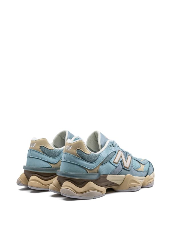 New Balance 9060 sneakers in the "Blue Haze" colorway, featuring a pastel blue and cream suede and mesh upper.