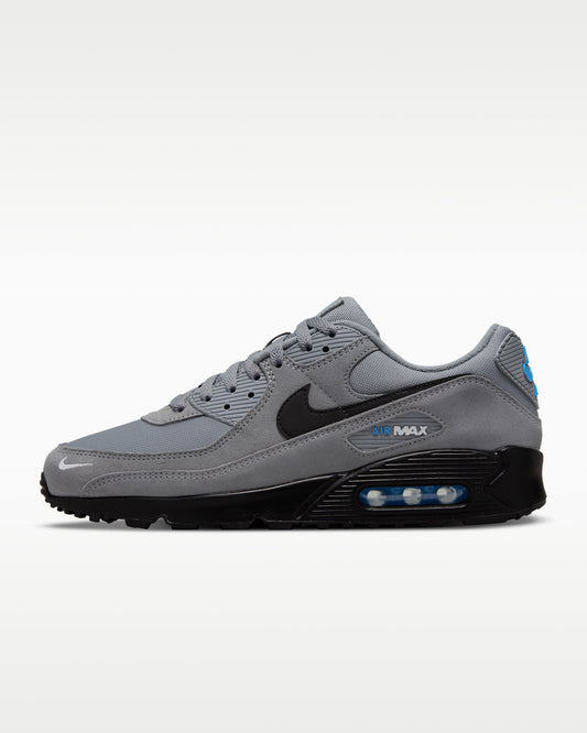 Nike Air Max 90 sneakers featuring a grey suede and mesh upper with a black midsole and swoosh.