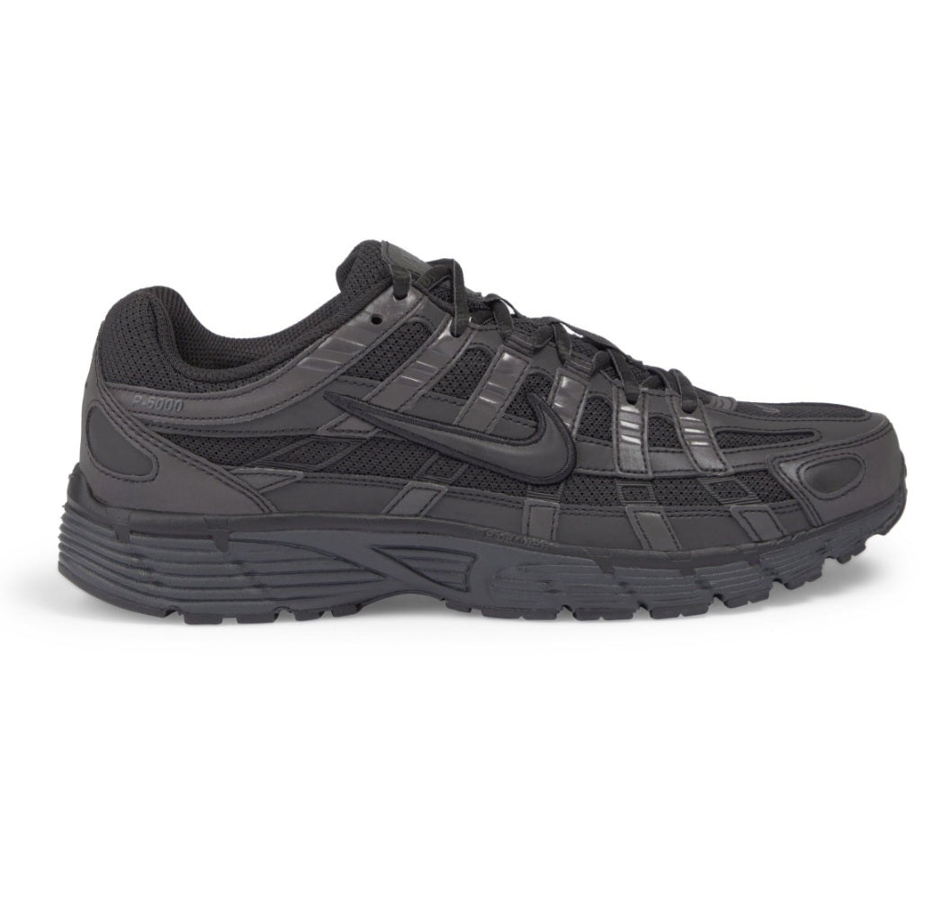 Nike P-6000 sneakers in a triple-black colorway, featuring a mix of breathable mesh and synthetic leather overlays.Design Inspiration: