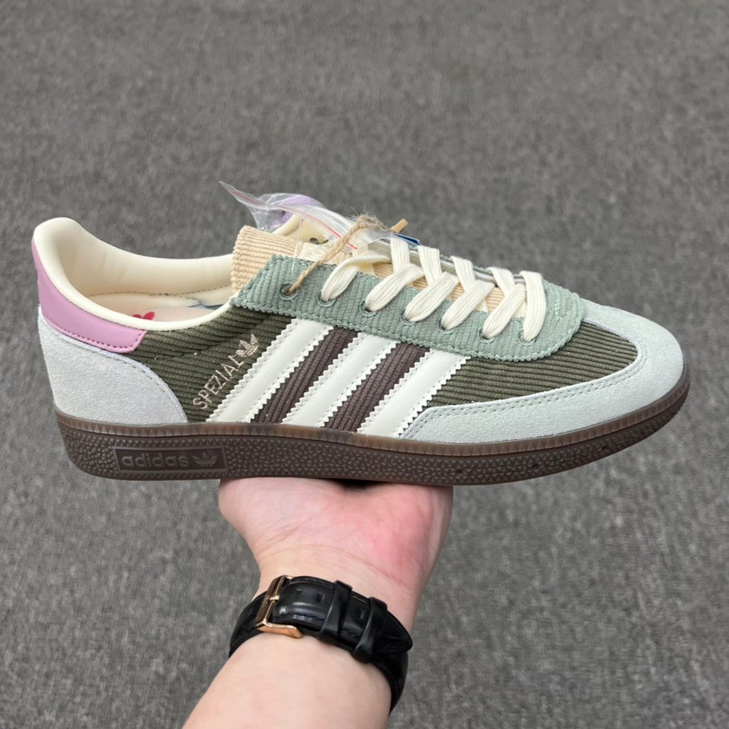 Adidas Handball Spezial sneakers in the "Silver Green/Magic Mauve" colorway, featuring a unique olive corduroy upper.